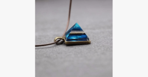Glowing Pyramid Pendant With Blue Crystal Add Some Shine And Color To Your Collection